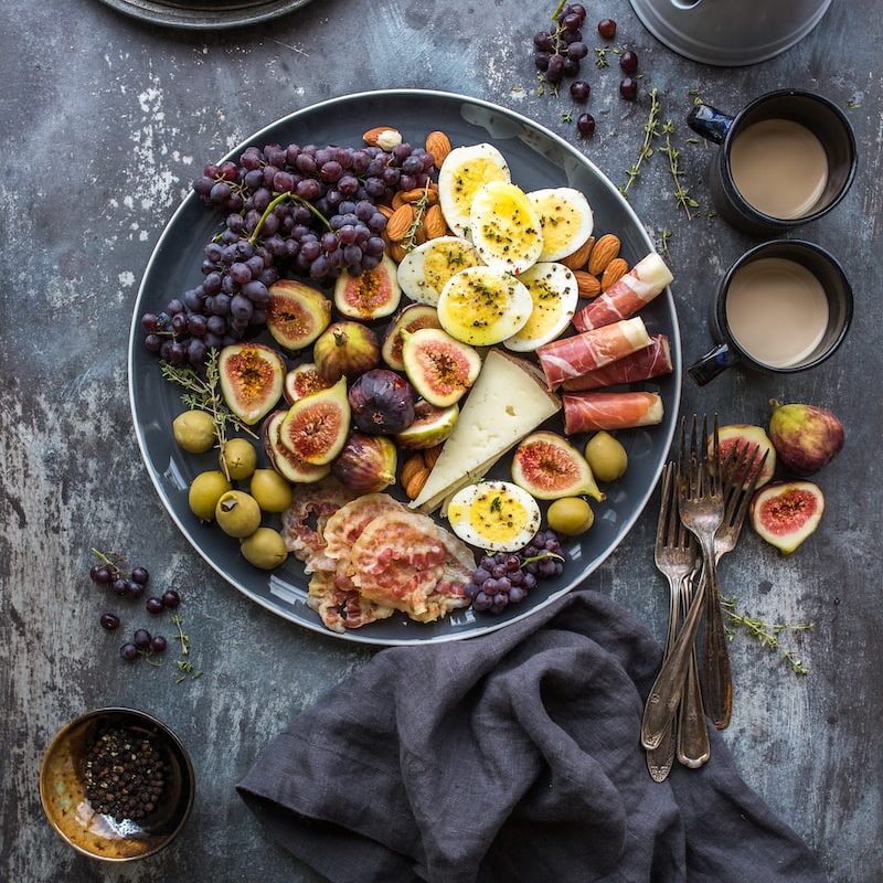 top view photography of fruits in plate